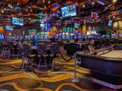 How do blockchain lottery tickets differ from paper versions?