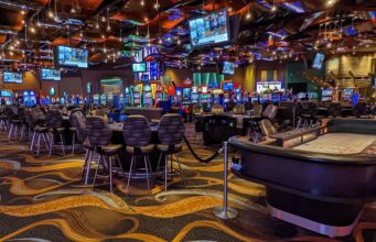 How do blockchain lottery tickets differ from paper versions?